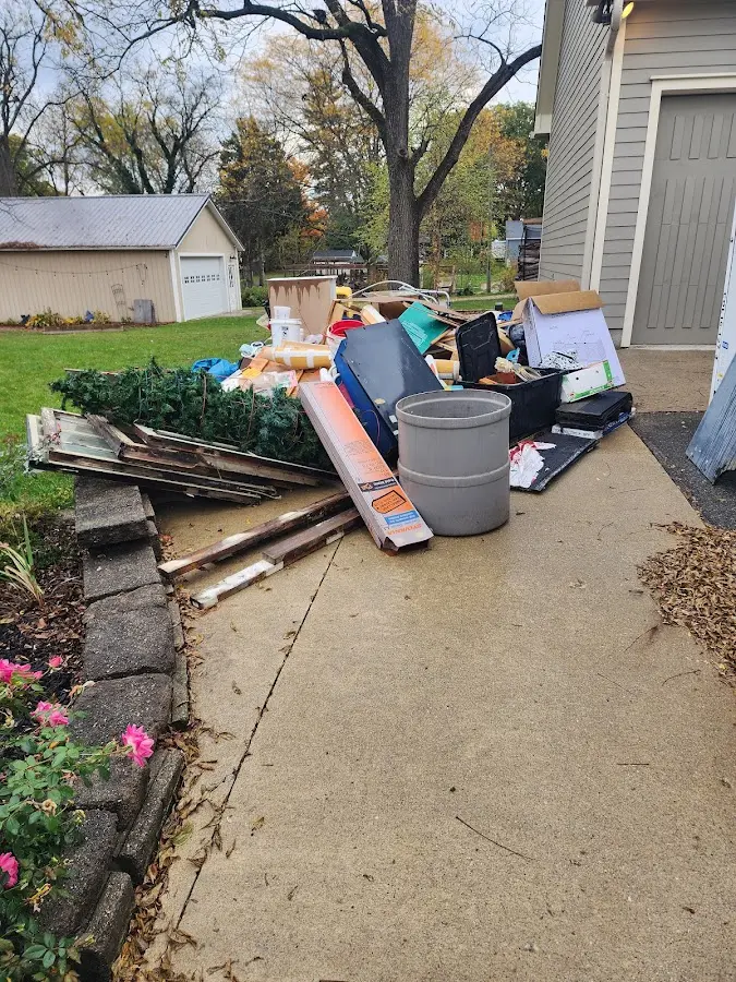 Dumpster being loaded with debris for Estate Cleanout Dumpster Rental in Arundel